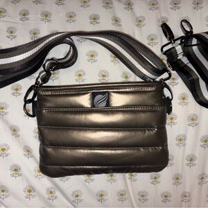 Think Rolyn metallic green bag